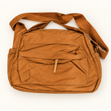 Multi-Pocket Handbag — Tan — AI-styled studio image