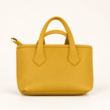 Pebble Mini Sling Bag — Mustard — studio image