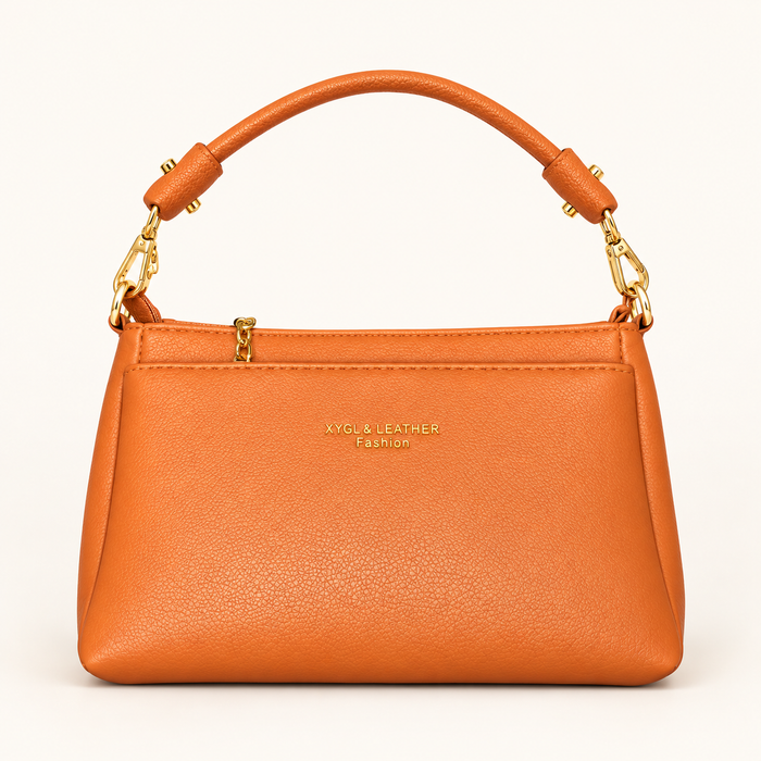 Gold Clip Handle Sling Bag — orange — studio image