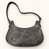 Star Buckle Sling Bag — charcoal back — AI-styled studio image